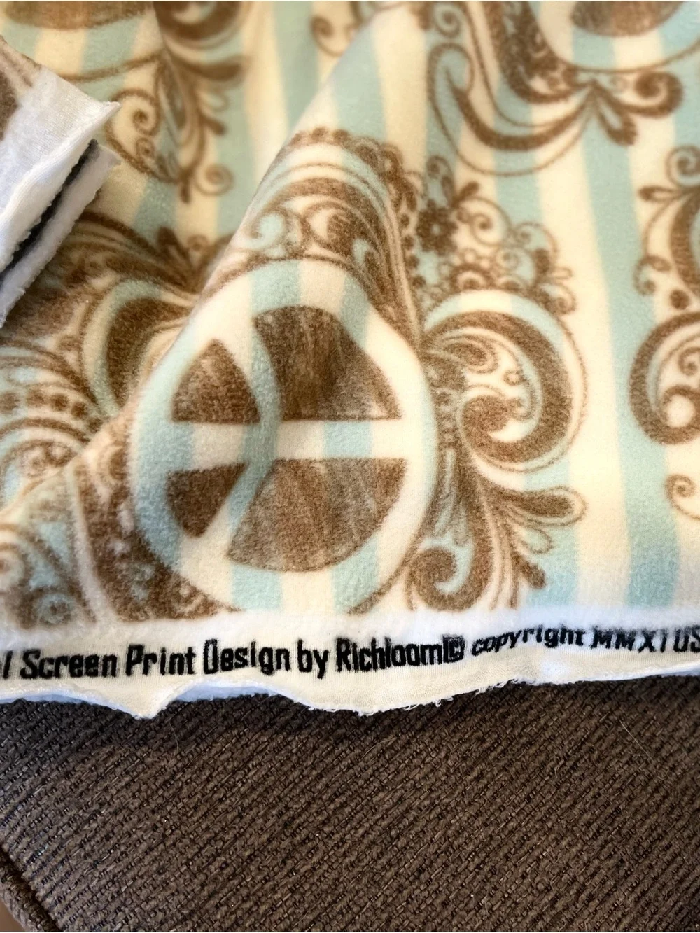 Cozy Peace Symbol Fleece Fabric - Aqua Blue & Brown